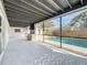 Covered patio features outdoor kitchen and screened in pool for modern living at 2520 Chanute Trl, Maitland, FL 32751