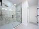 Glass shower enclosure features decorative tile, a bench, and shower niche at 2520 Chanute Trl, Maitland, FL 32751