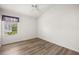 Bedroom featuring wood floors, white walls, ceiling fan, and a window with blinds at 2528 Buttonwood Run, The Villages, FL 32162