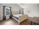 Vaulted ceiling bedroom features wood floors, neutral walls, and windows with gray curtains at 2528 Buttonwood Run, The Villages, FL 32162