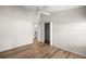 Bright bedroom with wood floors, closet, and ensuite bathroom at 2528 Buttonwood Run, The Villages, FL 32162