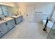 Gorgeous bathroom features modern vanity, standalone tub, and a sleek black faucet at 2643 Aloma Oaks Dr, Oviedo, FL 32765