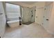 Beautiful bathroom with a standalone tub, tiled walls, and a sleek glass-enclosed shower at 2643 Aloma Oaks Dr, Oviedo, FL 32765