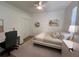 This is a picture of a well lit bedroom featuring a ceiling fan, a closet and an off white area rug at 2643 Aloma Oaks Dr, Oviedo, FL 32765