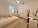 Bedroom featuring a ceiling fan, white bed frame, and a desk with a chair at 2643 Aloma Oaks Dr, Oviedo, FL 32765