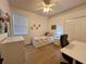 Well-lit bedroom with cozy bed and functional study area at 2643 Aloma Oaks Dr, Oviedo, FL 32765