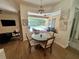 Bright breakfast nook with wood floors and pool view at 2643 Aloma Oaks Dr, Oviedo, FL 32765