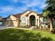 Charming single Gathering home with a manicured lawn, two car garage and gorgeous architectural details at 2643 Aloma Oaks Dr, Oviedo, FL 32765
