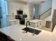 Modern kitchen featuring a center island, quartz countertops, and stainless steel appliances at 2643 Aloma Oaks Dr, Oviedo, FL 32765