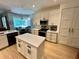 Charming kitchen with stainless appliances, island and bright dining area at 2643 Aloma Oaks Dr, Oviedo, FL 32765