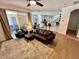 Open-concept living area with modern furnishings and hardwood floors at 2643 Aloma Oaks Dr, Oviedo, FL 32765