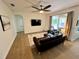 Modern living room featuring sleek furniture and ample natural light at 2643 Aloma Oaks Dr, Oviedo, FL 32765