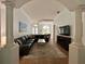 Spacious living room with wood floors, modern decor, and an arched entranceway at 2643 Aloma Oaks Dr, Oviedo, FL 32765