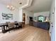 Bright and airy living and dining area with hardwood floors, chandelier, and modern decor at 2643 Aloma Oaks Dr, Oviedo, FL 32765