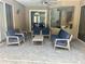 Outdoor patio with comfortable seating arrangements with four chairs, a couch and a coffee table at 2643 Aloma Oaks Dr, Oviedo, FL 32765
