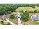 Aerial view of home with solar panels, an above-ground pool, and spacious green backyard at 2771 Ne 66Th St, Ocala, FL 34479