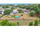 Aerial view of a house showing a spacious backyard with an above-ground pool and a screened porch at 2771 Ne 66Th St, Ocala, FL 34479