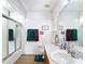 Well-lit bathroom shows a wood vanity, plus a clean, bright shower and vanity mirror at 2771 Ne 66Th St, Ocala, FL 34479