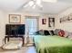 Bedroom with wood floor, ceiling fan, natural light and stylish decorations at 2771 Ne 66Th St, Ocala, FL 34479