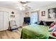 Comfortable bedroom with ceiling fan, wood flooring, and natural light at 2771 Ne 66Th St, Ocala, FL 34479