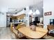 Open dining area with natural light and hardwood floors flows from kitchen to living room at 2771 Ne 66Th St, Ocala, FL 34479