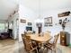 Bright dining room featuring hardwood floors, a wood dining table, and natural light at 2771 Ne 66Th St, Ocala, FL 34479