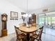 Cozy dining room with hardwood floors, chandelier, and wood dining table at 2771 Ne 66Th St, Ocala, FL 34479