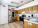 Functional kitchen with stainless steel appliances and oak cabinets at 2771 Ne 66Th St, Ocala, FL 34479