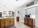 Functional kitchen with oak cabinets and stainless steel appliances and dining area at 2771 Ne 66Th St, Ocala, FL 34479
