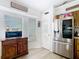 Bright eat-in kitchen featuring stainless steel refrigerator, wooden cabinets, and wood plank flooring at 2771 Ne 66Th St, Ocala, FL 34479