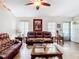 Spacious living room featuring comfortable seating, decor, hardwood floors, and a ceiling fan at 2771 Ne 66Th St, Ocala, FL 34479
