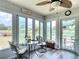 Relaxing sunroom with a fan, seating, and natural light, perfect for leisure at 2771 Ne 66Th St, Ocala, FL 34479