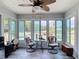 Inviting sunroom with a ceiling fan and views of the outdoor scenery at 2771 Ne 66Th St, Ocala, FL 34479