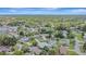 An aerial shot of a residential area featuring tree-lined streets and various community amenities at 2835 Bongart Rd, Winter Park, FL 32792
