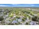 An aerial shot showing the neighborhood's lush greenery and the well-spaced single-Gathering homes at 2835 Bongart Rd, Winter Park, FL 32792
