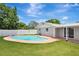 A backyard features a private pool and is surrounded by well-maintained landscaping, creating a relaxing oasis at 2835 Bongart Rd, Winter Park, FL 32792