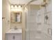 Bathroom features a glass enclosed shower and a vanity with framed mirror at 2835 Bongart Rd, Winter Park, FL 32792