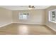 Bright bedroom with two windows offering lots of natural light and new floors at 2835 Bongart Rd, Winter Park, FL 32792