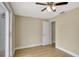 Bright bedroom featuring wood-look floors, ceiling fan, closet, and access to the bathroom at 2835 Bongart Rd, Winter Park, FL 32792