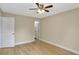 Bedroom with hardwood floors and view into hall and bathroom at 2835 Bongart Rd, Winter Park, FL 32792