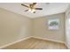 Bedroom with ceiling fan, light hardwood floors, and window at 2835 Bongart Rd, Winter Park, FL 32792