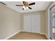 Bedroom featuring wood-look floors, ceiling fan, closet, and sliding glass door at 2835 Bongart Rd, Winter Park, FL 32792