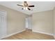 Bedroom with hardwood floors, a ceiling fan, doorway, and a closet at 2835 Bongart Rd, Winter Park, FL 32792
