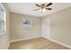 Bedroom features include hardwood floors, a window, and a closet at 2835 Bongart Rd, Winter Park, FL 32792