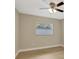 A bright bedroom with light wood floors, ceiling fan, and a window at 2835 Bongart Rd, Winter Park, FL 32792