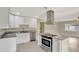 Well-lit kitchen featuring an island, granite countertops, and modern stainless steel appliances at 2835 Bongart Rd, Winter Park, FL 32792