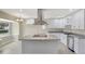 Bright kitchen features granite countertops, stainless steel appliances, and a spacious island at 2835 Bongart Rd, Winter Park, FL 32792