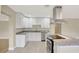 Well-lit kitchen featuring an island, granite countertops, and modern stainless steel appliances at 2835 Bongart Rd, Winter Park, FL 32792