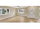 Bright living room with new floors, windows offering lots of natural light and a ceiling fan at 2835 Bongart Rd, Winter Park, FL 32792
