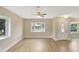 Bright living room with new floors and large windows providing lots of natural light at 2835 Bongart Rd, Winter Park, FL 32792